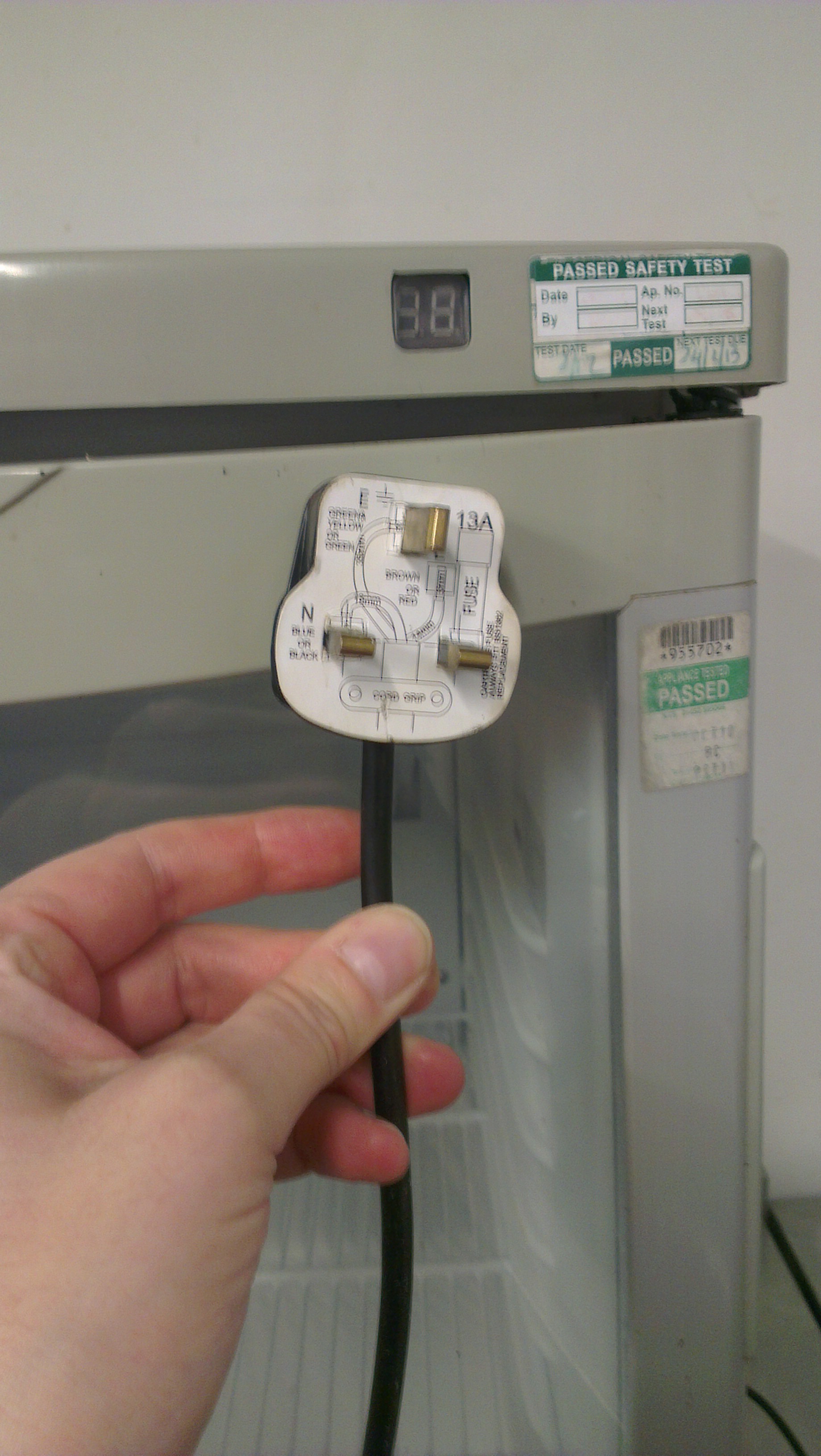2014-05-09 11.33.49 How many PAT inspections did this fridge have and nobody removed the cardboard to check in the plug!